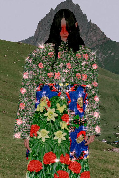 An artistic collage features a figure with long dark hair against a mountain backdrop, wearing a garment and holding a bouquet of flowers, all constructed from pixelated floral patterns and star-like sparkles.