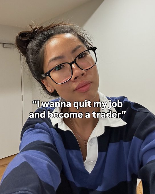 A woman wearing glasses and a blue striped polo shirt with text overlay reading 'I wanna quit my job and become a trader'.