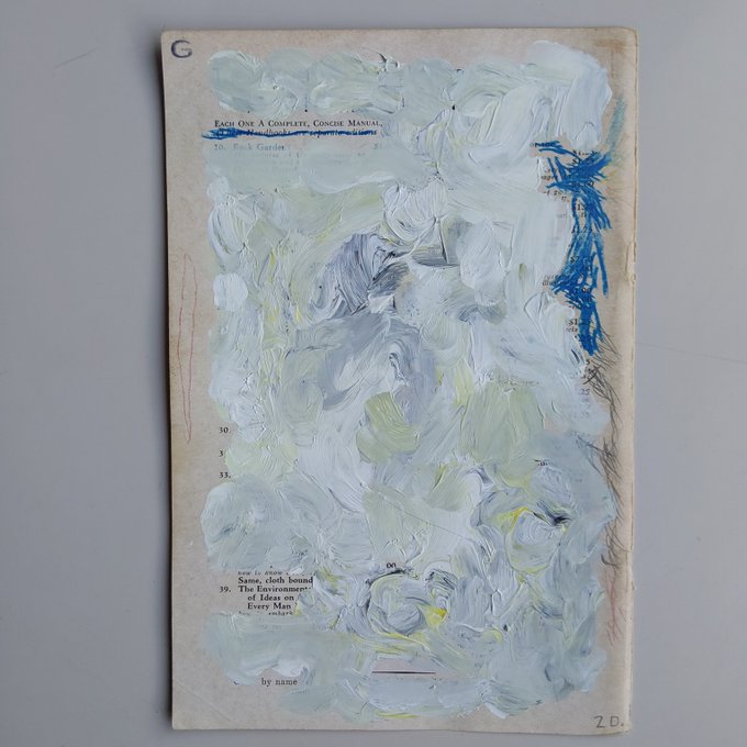 An abstract mixed-media artwork on a book page covered with thick white, gray, and pale yellow paint strokes over visible printed text.