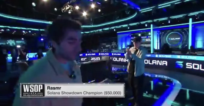 A screenshot from the WSOP Solana Showdown tournament with on-screen text identifying 'Rasmr' as the 'Solana Showdown Champion ($50,000)' in a poker studio setting.