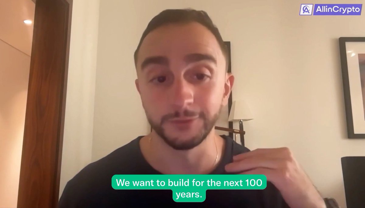 A man with a beard in a black shirt speaks to the camera, with the AllinCrypto logo and the caption 'We want to build for the next 100 years.'