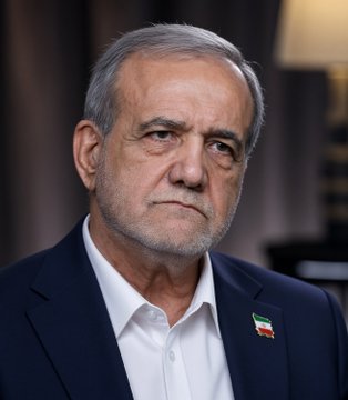 A portrait of an older man with gray hair and a beard wearing a dark suit jacket with an Iranian flag pin on the lapel.