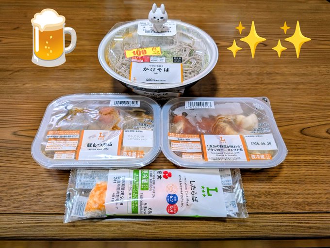 Four Japanese convenience store food items arranged on a wooden table, including soba noodles and bento boxes from 7-Eleven, Lawson, and FamilyMart, decorated with beer and sparkle emojis.
