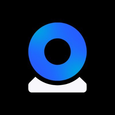 A blue gradient webcam icon sits centered on a black background, likely symbolizing the AI-powered observation or prediction capabilities of @prophetmarketai, the platform featured in the post about trading against AI on future events.
