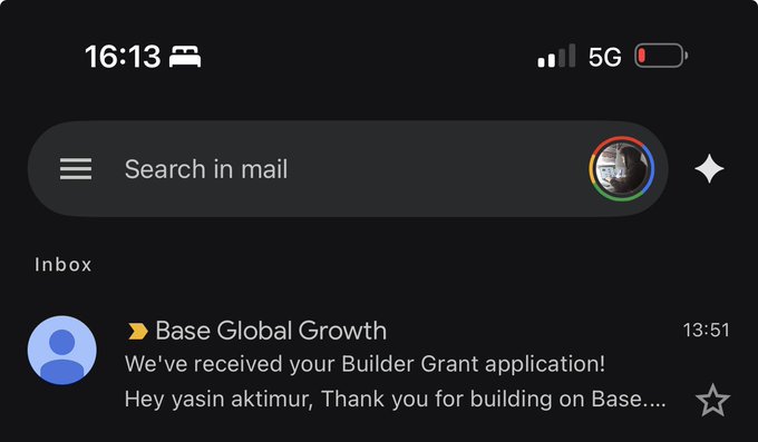 The image shows an email notification from "Base Global Growth" confirming receipt of a Builder Grant application addressed to yasın aktımur. This relates to the post celebrating that the Base Builder Grant application was successfully submitted, marking the start of an ecosystem fund initiative giving away $1500 to VR Nouns signers and flooor.fun users.