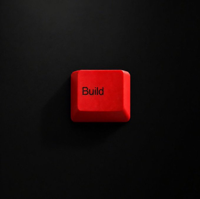 A vibrant red keyboard key labeled "Build" is illuminated against a stark black background, symbolizing the call to action for developers creating within the TRON ecosystem. The image reinforces the post's theme of empowering builders to shape the future across DeFi, AI, gaming, NFTs, stablecoins, and enterprise infrastructure.