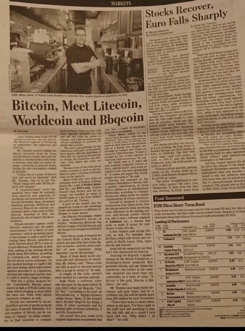 The newspaper clipping shows a Markets section article titled "Stocks Recover; Euro Falls Sharply" alongside a related story headlined "Bitcoin, Meet Litecoin, Worldcoin and Beqcoin," referencing cryptocurrencies including Litecoin ($LTC). The image supports the post's claim by featuring an early article about Litecoin's emergence, with a caption quoting Beqzhat Mueez, executive director and chief of Celsius Blockchain, discussing the rise of cryptocurrencies beyond Bitcoin—including memecoins like Worldcoin and Beqcoin—around the time of the 2014 Bitcoin price drop.