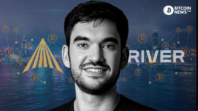 A smiling man is featured against a backdrop showing the word "RIVER" with Bitcoin logos and a nighttime cityscape, with "BitcoinNews.com" in the top right corner.