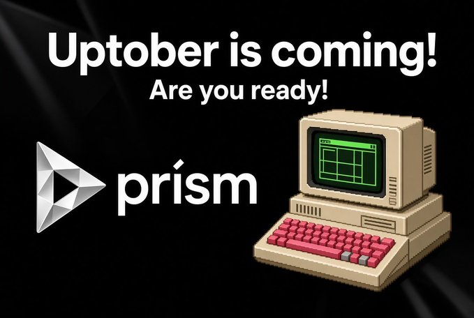 A promotional graphic with text 'Uptober is coming! Are you ready!' featuring the 'prism' logo and an illustration of a retro beige computer with a pink keyboard.