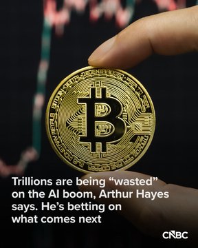 A close-up of a Bitcoin token held between fingers, displayed alongside text reading "Trillions are being 'wasted' on the AI boom, Arthur Hayes says. He's betting on what comes next" with the CNBC logo, accompanying an article about former BitMEX CEO Arthur Hayes predicting an AI bubble burst will trigger a crypto bailout rally.