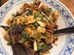 The image shows a plate of stir-fried noodles mixed with vegetables like cilantro and peppers, with chopsticks resting on top.

However, there's a disconnect here—the post talks about a "fitness fund," weight loss goals, and using a scale, but the image shows a hearty, oily noodle dish that's not typically associated with dieting or fat loss goals.
