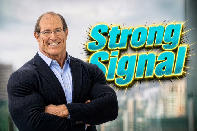 A promotional image featuring a smiling older man in a dark blazer and glasses with arms crossed next to bold comic-style text reading 'Strong Signal' against a city backdrop.