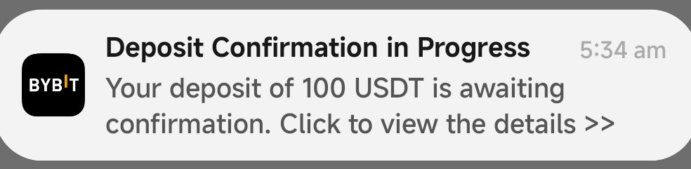 A Bybit push notification displayed at 5:34 am reading 'Deposit Confirmation in Progress - Your deposit of 100 USDT is awaiting confirmation. Click to view the details >>'.