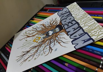 A handmade zine or booklet titled 'ABENAKIN ZINE' featuring an illustration of a tree with a face, placed on a background of colorful markers or pens.