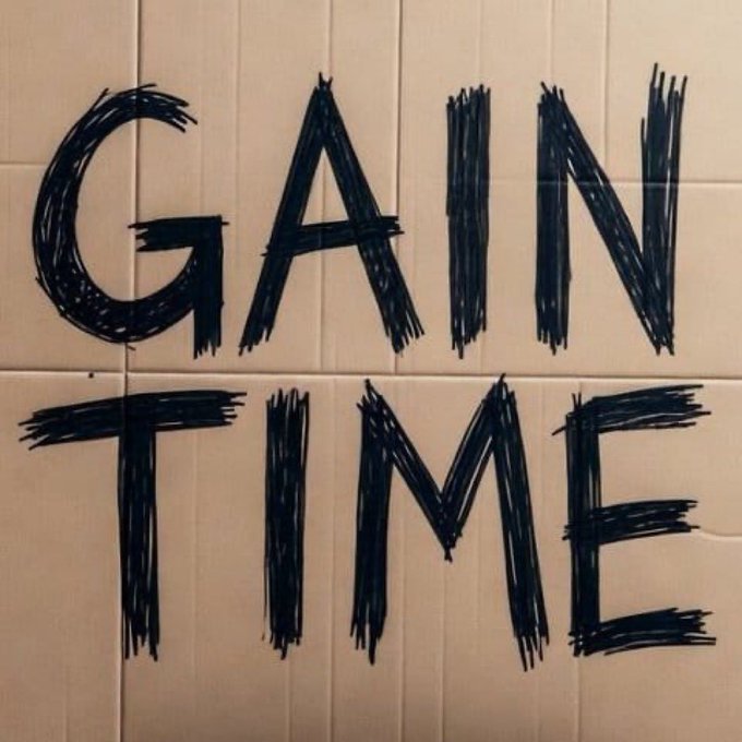 The word "GAIN TIME" is scribbled in bold black marker across white tiled walls, symbolizing effort and perseverance toward progress. It reinforces the post's message about dedicating focused, useful time and support to achieve meaningful results.
