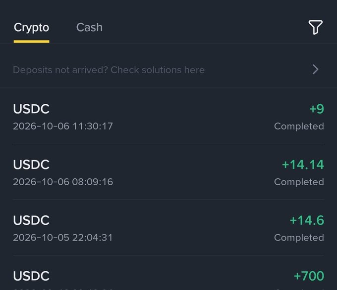 A crypto transaction history screen showing multiple completed USDC deposits including +9, +14.14, +14.6, and +700 USDC.