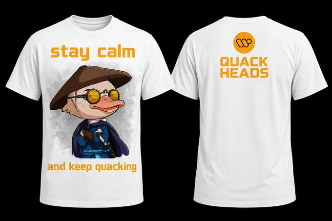 The image features a white t-shirt with an orange duck wearing a hat and glasses, accompanied by the text "Stay calm and keep quacking" written above and below the duck's head. The back of the shirt displays additional text that reads "Quack I keep dreaming about putting NFT IPs to use Some of the @wallchain Quack Heads have such beautiful traits, they would make really cool merch".