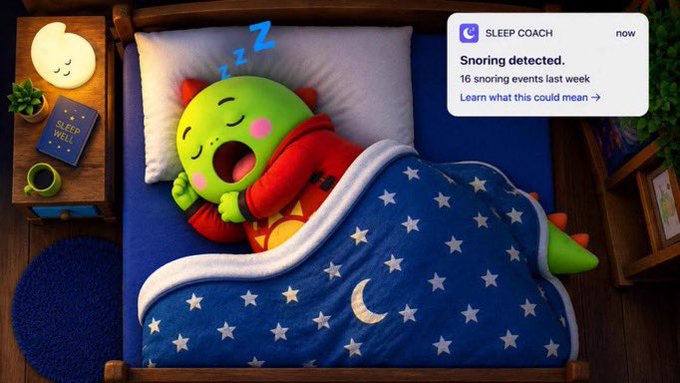 A 3D render of a green dinosaur-like character sleeping in a bed with a starry blanket, accompanied by a 'Sleep Coach' app notification detecting snoring (16 snoring events last week) with a 'Sleep Well' book on the nightstand.