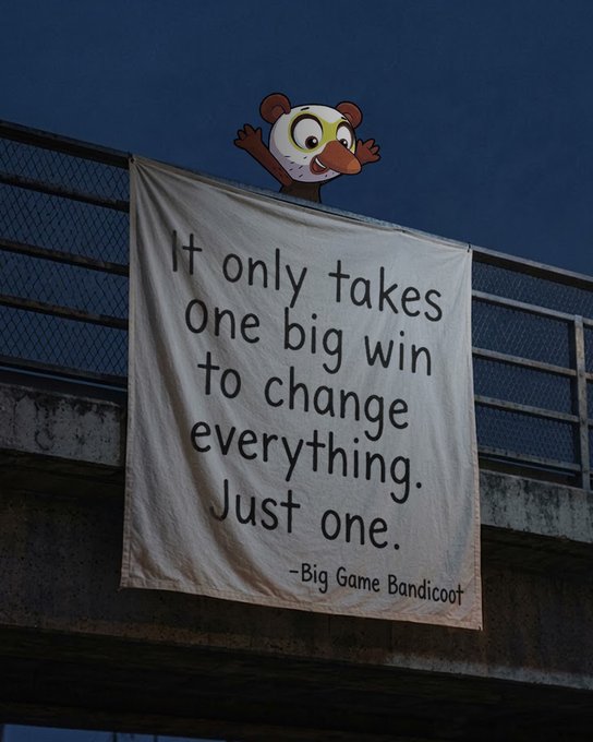 A banner on a concrete overpass against a dark sky reads 'It only takes one big win to change everything. Just one. -Big Game Bandicoot', with a small cartoon animal character peeking over the top.