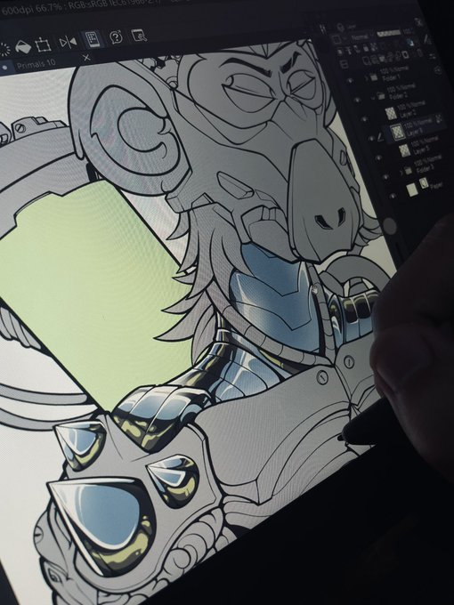 A digital artist uses a stylus on a tablet to illustrate a detailed, armored, animalistic character design.