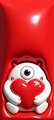 A small, cropped close-up image of a white teddy bear holding a red heart against a solid red background.