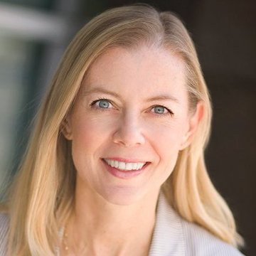The image shows a smiling woman with long blonde hair and blue eyes, presumably Kristina Campbell, who has been appointed to SUI Group Holdings' (SUIG) Board of Directors, bringing her experience as former Ripple CFO where she established XRP's treasury governance framework.