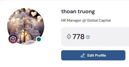 The image shows a screenshot of an editing feature within a social media platform. The focus is on the edited profile page, which appears to be in "editor mode". The image features a large tree with white decorations adorning its branches against a gray background. On this screen, there is text that reads "@THOAN TRUONG", which likely refers to a person's name or profile information within the social media platform. Additionally, the post mentions "HR Manager (Global Capital) @ Global Capital". The user interface also has a small button in the upper left corner with an arrow pointing towards it and a text that reads " Edit Profile".