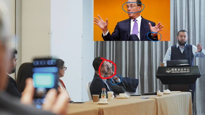 The image shows a conference setting at the "National Conference Center" (国家会议中心), with a presenter speaking at a podium and an audience seated at a panel table, including an inset photo of a man in a suit gesturing with both hands. The circled annotations on faces suggest a focus on facial recognition or deepfake/manipulation detection, which relates to the post's likely theme of BlackRock's involvement with Chainlink ($LINK) in advancing AI and identity verification technologies.