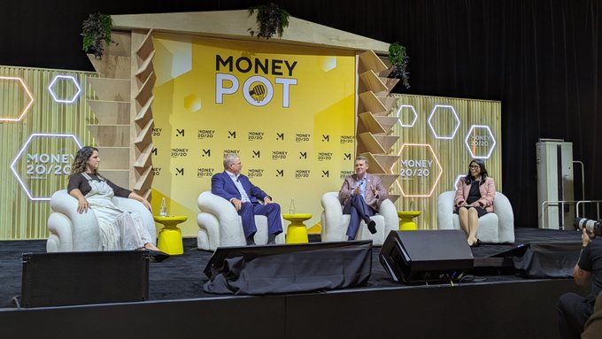 Four panelists sit on armchairs on a conference stage beneath a large yellow sign reading “MONEY POT,” with repeated “MONEY 20/20” branding across the backdrop.
