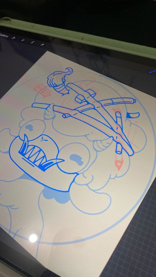 A digital drawing on a screen showing a blue and red sketch of a cartoon monster with sharp teeth holding an axe.