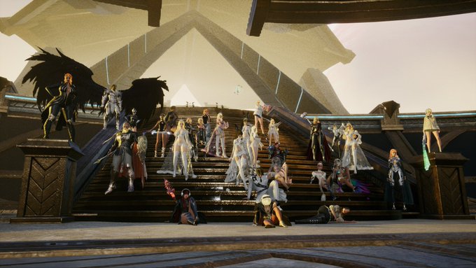 A screenshot from a video game or 3D environment showing a large group of fantasy character avatars gathered on stone steps.