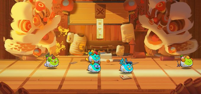 The image features three cartoon characters, each with their own unique design and color scheme. The characters are positioned at different locations within an anime-style setting, which includes a stage or platform that appears to be made of wood. The background of the scene is filled with orange lanterns, adding a warm and vibrant atmosphere to the overall composition.