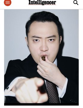 The image shows a man in a black suit and tie eating a snack while pointing directly at the camera, featured on the Intelligencer (New York Magazine) cover. The caption connects this to Justin Sun (孙宇晨, H.E. Justin Sun), founder of TRON, highlighting his appearance on the cover of New York Magazine as a symbol of his rise from crypto entrepreneur to mainstream international media presence.