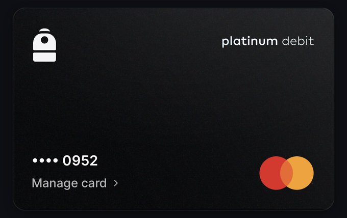 A sleek black platinum debit card with card number ending in 0952, a smartwatch/wallet icon, and a Mastercard logo, with a 'Manage card' link.