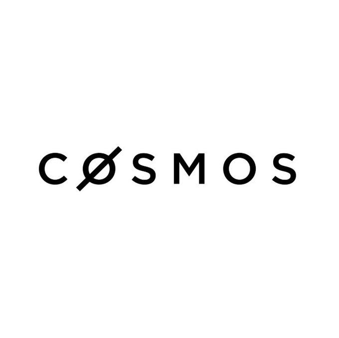 A minimalist logo featuring the word "COSMOS" in black capital letters on a white background, with a stylized symbol replacing the "O".