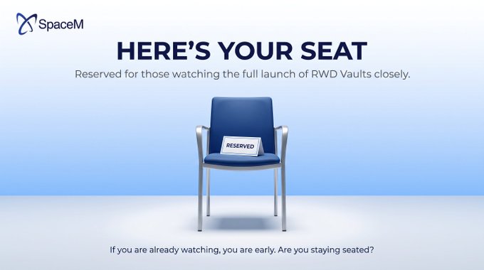 A SpaceM promotional image displays a blue chair with a 'RESERVED' sign on it, with text reading 'HERE'S YOUR SEAT - Reserved for those watching the full launch of RWD Vaults closely.'