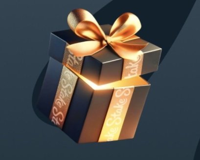 A sleek dark gift box adorned with a golden ribbon and bow radiates a warm glow, with the word "Stake" elegantly displayed on its patterned ribbons. The image ties into the post by symbolizing a return or reward on the Stake platform, inviting users to share their usernames for a potential gifting or tipping initiative.