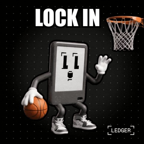 The image features a cartoon basketball character with white face and black body holding an orange basketball while standing next to a basketball hoop, which has a basketball going through it. The caption reads "Lock In" above the basketball character, and there are dots surrounding the basketball character on the right side of the image.