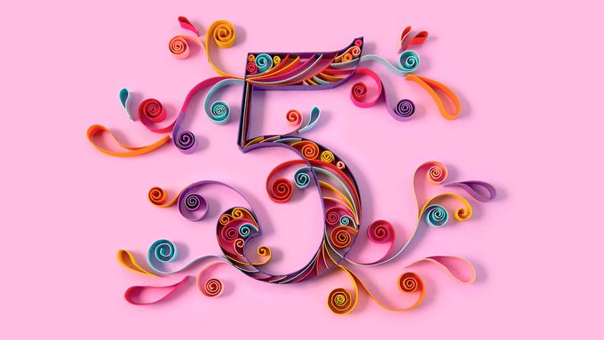 A vibrant quilling paper craft of the number '5' in various colorful swirls and curls, set against a solid pink background.