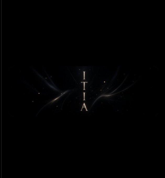 A dark image with the text "ITIA" arranged vertically in the center, surrounded by faint, wispy light patterns and small glowing specks on a black background.