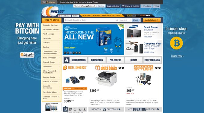 The image shows the Newegg website homepage featuring a "Pay With Bitcoin" promotional banner on the left side advertising "5 simple steps to paying smarter" alongside the Bitcoin logo, with product listings visible including Intel products, Canon imageCLASS printers priced at $399.99, and Sparkle gaming PCs at $69.99. This historic screenshot commemorates Newegg's pioneering role as one of the first major retailers to accept Bitcoin as payment, with the Bitcoin ticker (BTC) prominently displayed to highlight the crypto integration on the e-commerce platform.