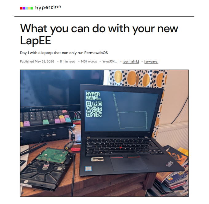 The image shows an open laptop computer sitting on top of a wooden desk. The screen displays a message that reads "What you can do with your new LapEE", which seems to be related to the laptop's setup or instructions for using it. There are also several books scattered around the desk, indicating that this might be a workspace or study area.