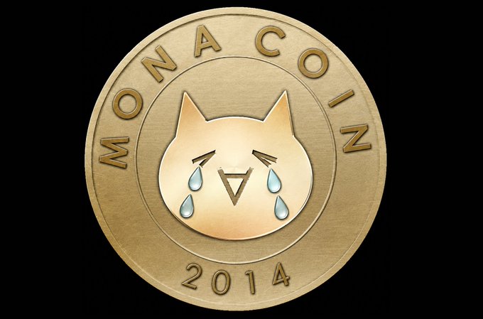 A gold-colored Monacoin commemorative coin with "MONACOIN" engraved around the top edge and "2014" at the bottom, featuring a crying cat mascot with the Monacoin symbol on its face. The image relates to the post by visually representing the distressed state of the Monacoin network, whose mascot cat appears to be crying—mirroring the user's alarm that block generation has stalled for over 22 hours.
