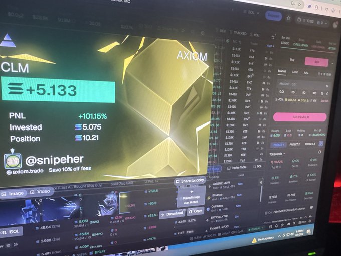 A computer monitor displays a trading interface for AXIOM (CLM) showing a gain of +5.133, a PNL of +101.15%, an invested amount of 5.075, and a position of 10.21, with the handle @snipeher and a referral link to axiom.trade visible.
