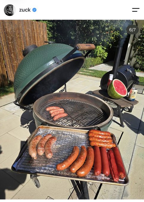 A screenshot from the Instagram account 'zuck' (verified) shows an outdoor grilling setup featuring a Big Green Egg smoker and a tray of various sausages and hot dogs being cooked.