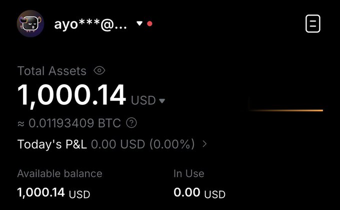 A cryptocurrency trading app screenshot showing an account with a username 'ayo***@...' and total assets of 1,000.14 USD (approximately 0.01193409 BTC), with an available balance of 1,000.14 USD and 0.00 USD in use.