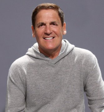 A photo of Mark Cuban smiling in a gray hoodie, shown as the subject of a post in which he predicts that AI chips will become a major new asset class comparable to cryptocurrency.