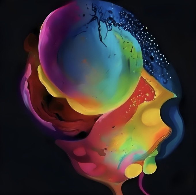 An abstract, vibrant digital artwork featuring swirling, dripping liquid colors in pink, blue, yellow, green, and red set against a dark background, with small particles floating throughout.