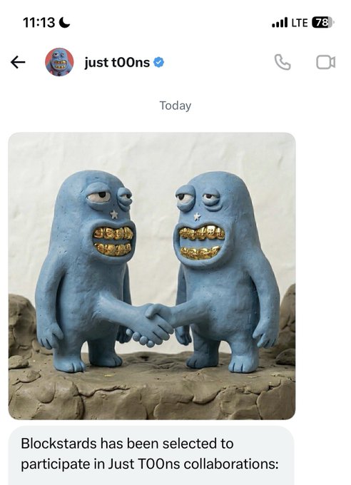 A mobile message from 'just t00ns' announcing that 'Blockstars has been selected to participate in Just T00ns collaborations,' accompanied by a sculpture of two blue creatures with gold teeth shaking hands.