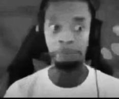 A grayscale reaction meme shows a wide-eyed man in a gaming chair looking forward, wearing a headset. It illustrates the post’s disappointment about a star quarterback, possibly Jalen Hurts, being “turned into paste” after being sacked.